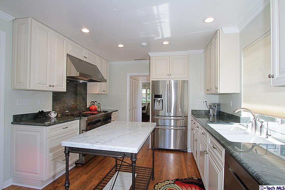 3690 Newhaven Road Pasadena, CA 91107 - Photo 9 of 21 a kitchen with granite countertop a sink a counter space stainless steel appliances and cabinets