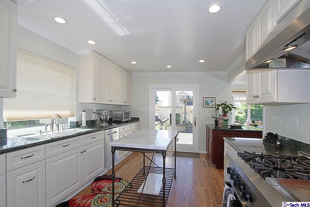 3690 Newhaven Road Pasadena, CA 91107 - Photo 10 of 21 a kitchen with a sink stove and cabinets