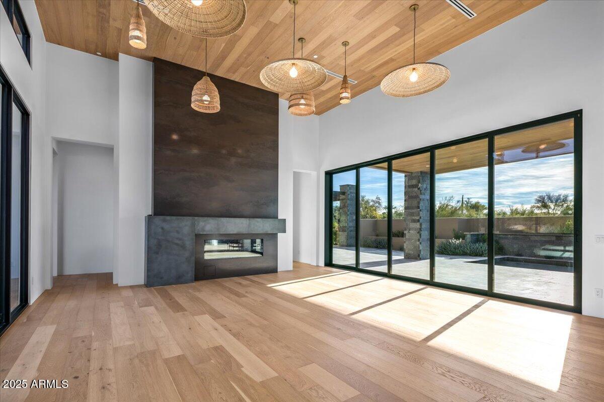 10249 East Joy Ranch Road Scottsdale, AZ 85262 - Photo 11 of 57 a bedroom with a bed and a large window