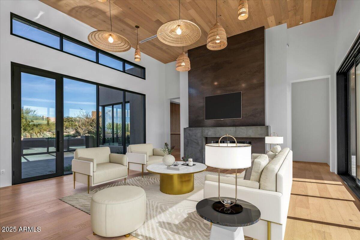 10249 East Joy Ranch Road Scottsdale, AZ 85262 - Photo 13 of 57 a living room with furniture and a flat screen tv