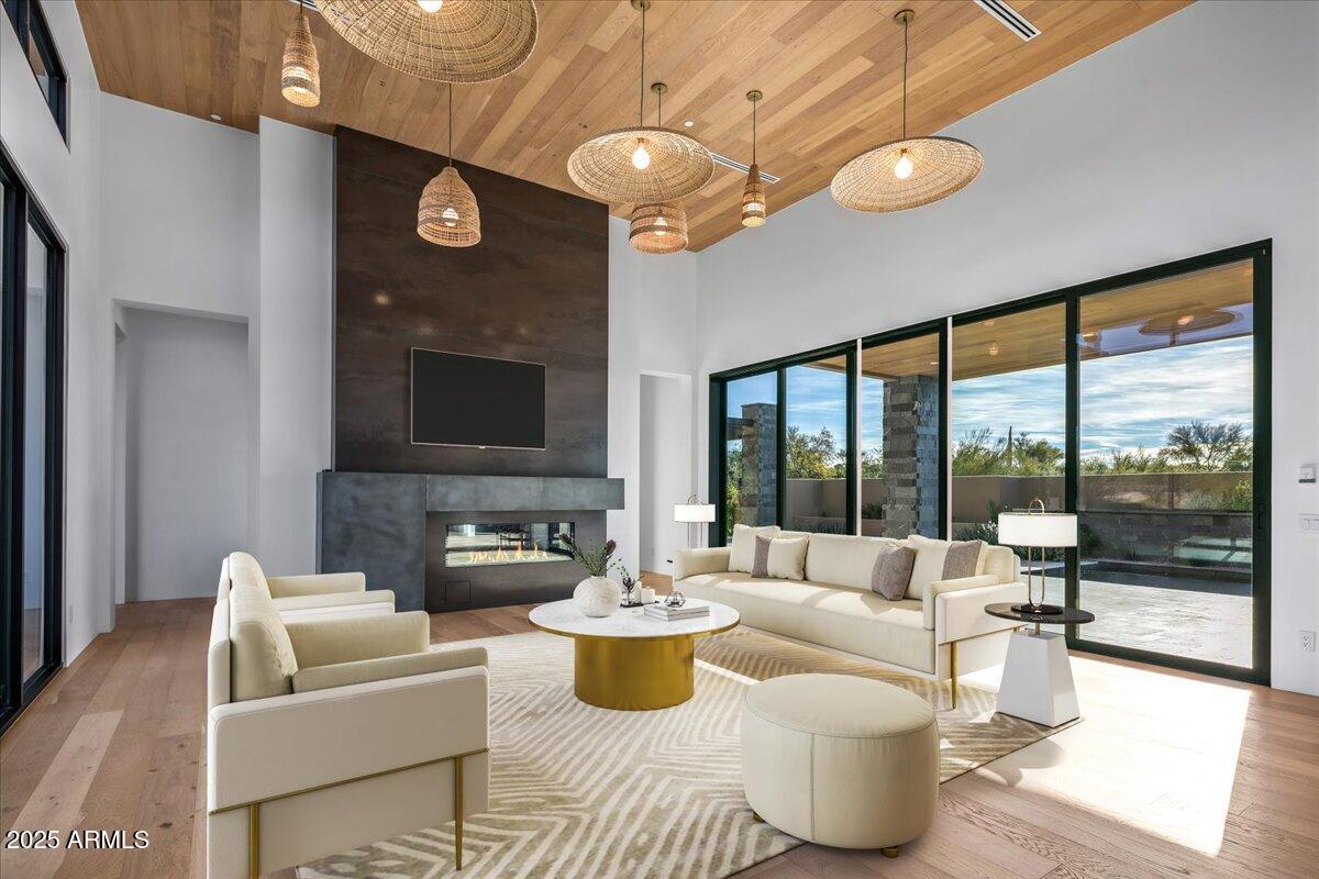 10249 East Joy Ranch Road Scottsdale, AZ 85262 - Photo 14 of 57 a living room with patio furniture and a large window