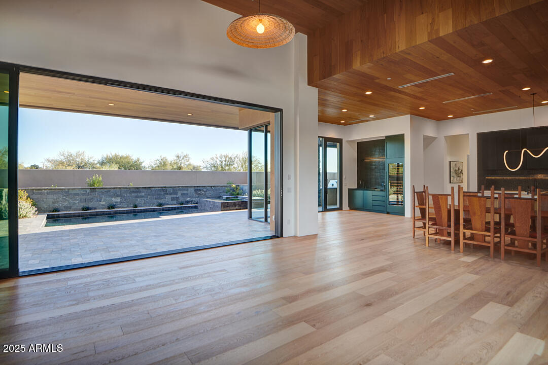 10249 East Joy Ranch Road Scottsdale, AZ 85262 - Photo 15 of 57 a view of dining room with furniture and wooden floor