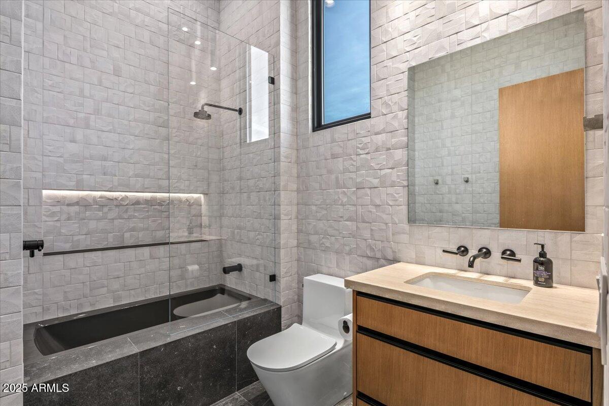 10249 East Joy Ranch Road Scottsdale, AZ 85262 - Photo 36 of 57 a bathroom with a sink a toilet and shower