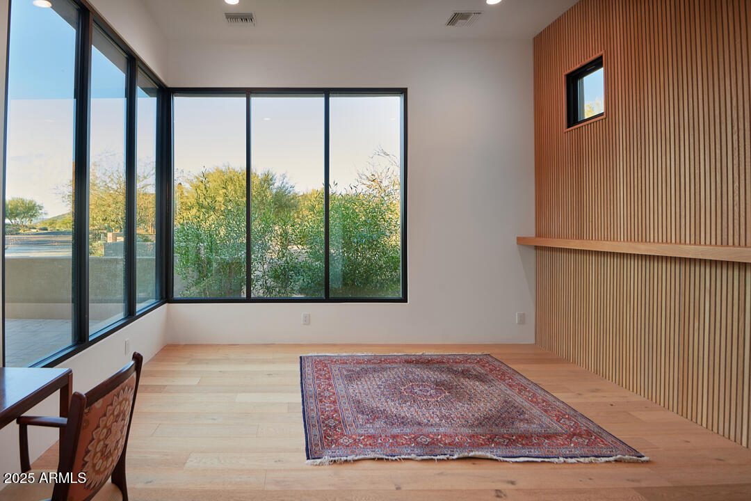 10249 East Joy Ranch Road Scottsdale, AZ 85262 - Photo 39 of 57 a view of an empty room with wooden floor and a window