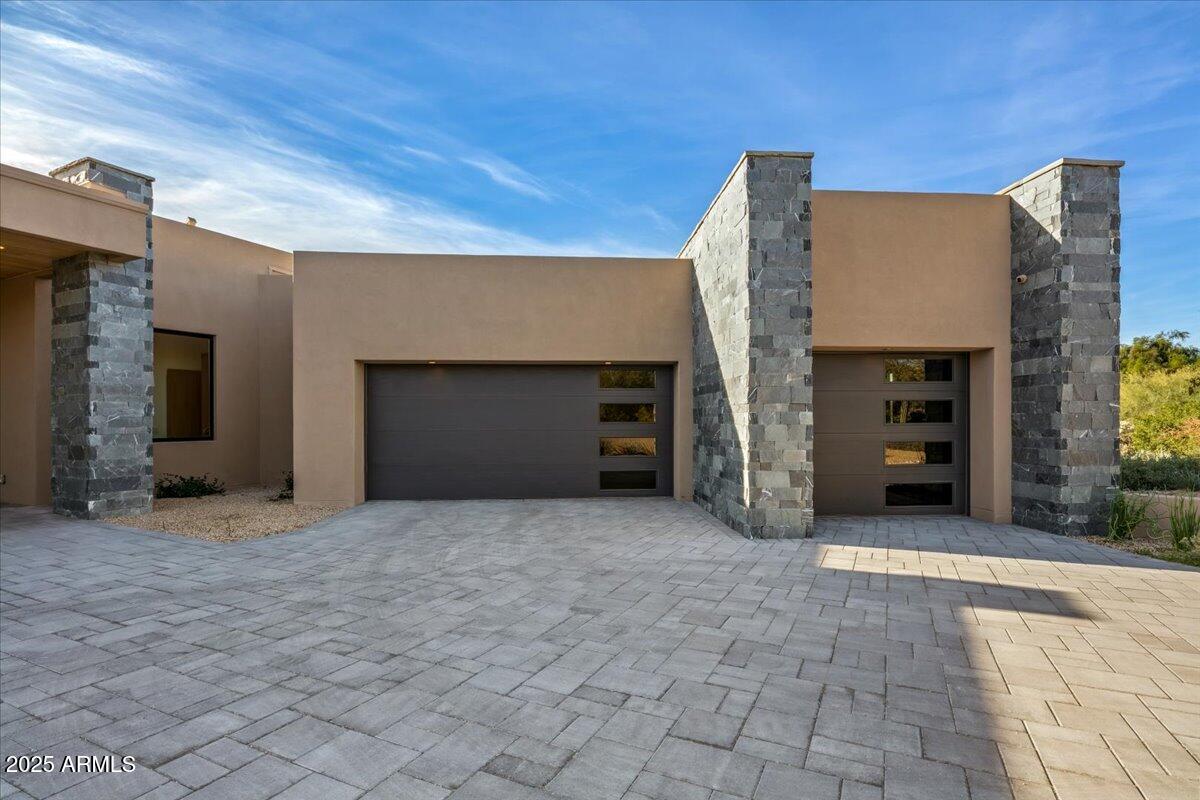 10249 East Joy Ranch Road Scottsdale, AZ 85262 - Photo 44 of 57 a view of a house with an empty space and a garage