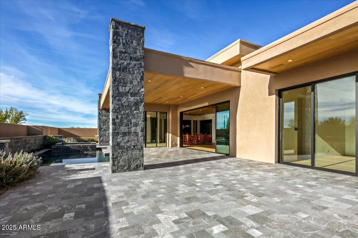 10249 East Joy Ranch Road Scottsdale, AZ 85262 - Photo 48 of 57 a view of a house with backyard and porch