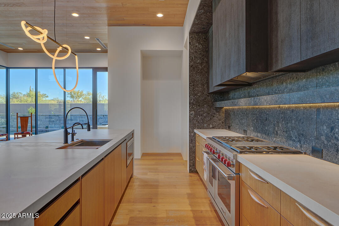 10249 East Joy Ranch Road Scottsdale, AZ 85262 - Photo 6 of 57 a kitchen with stainless steel appliances granite countertop a sink and a stove