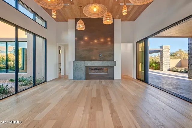 a living room with kitchen island granite countertop furniture and fireplace