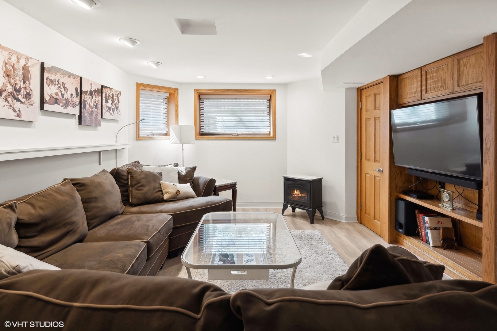1920 West Addison Street Chicago, IL 60613 - Photo 12 of 34 a living room with furniture a flat screen tv and a refrigerator