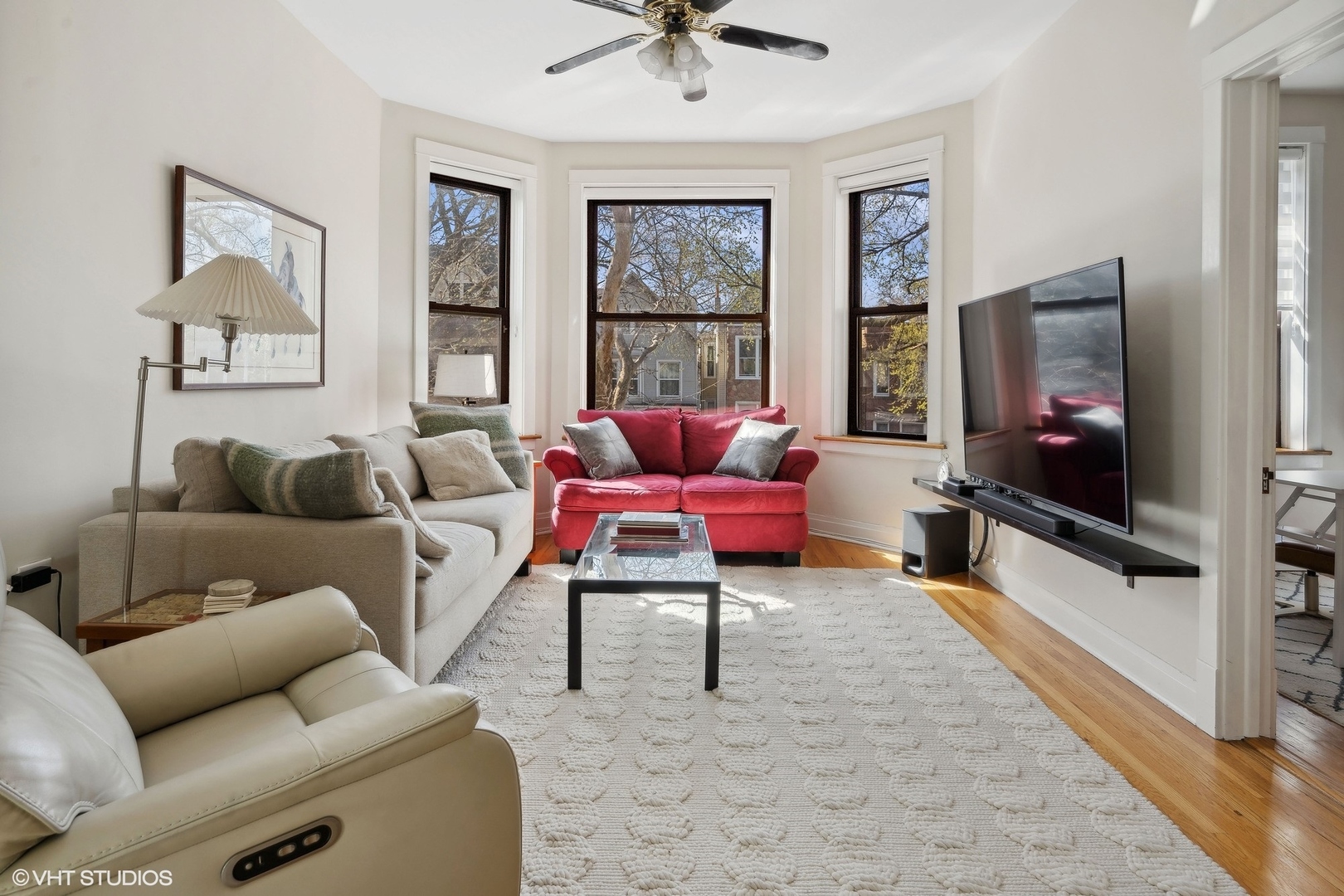 1920 West Addison Street Chicago, IL 60613 - Photo 18 of 34 a living room with furniture and a flat screen tv