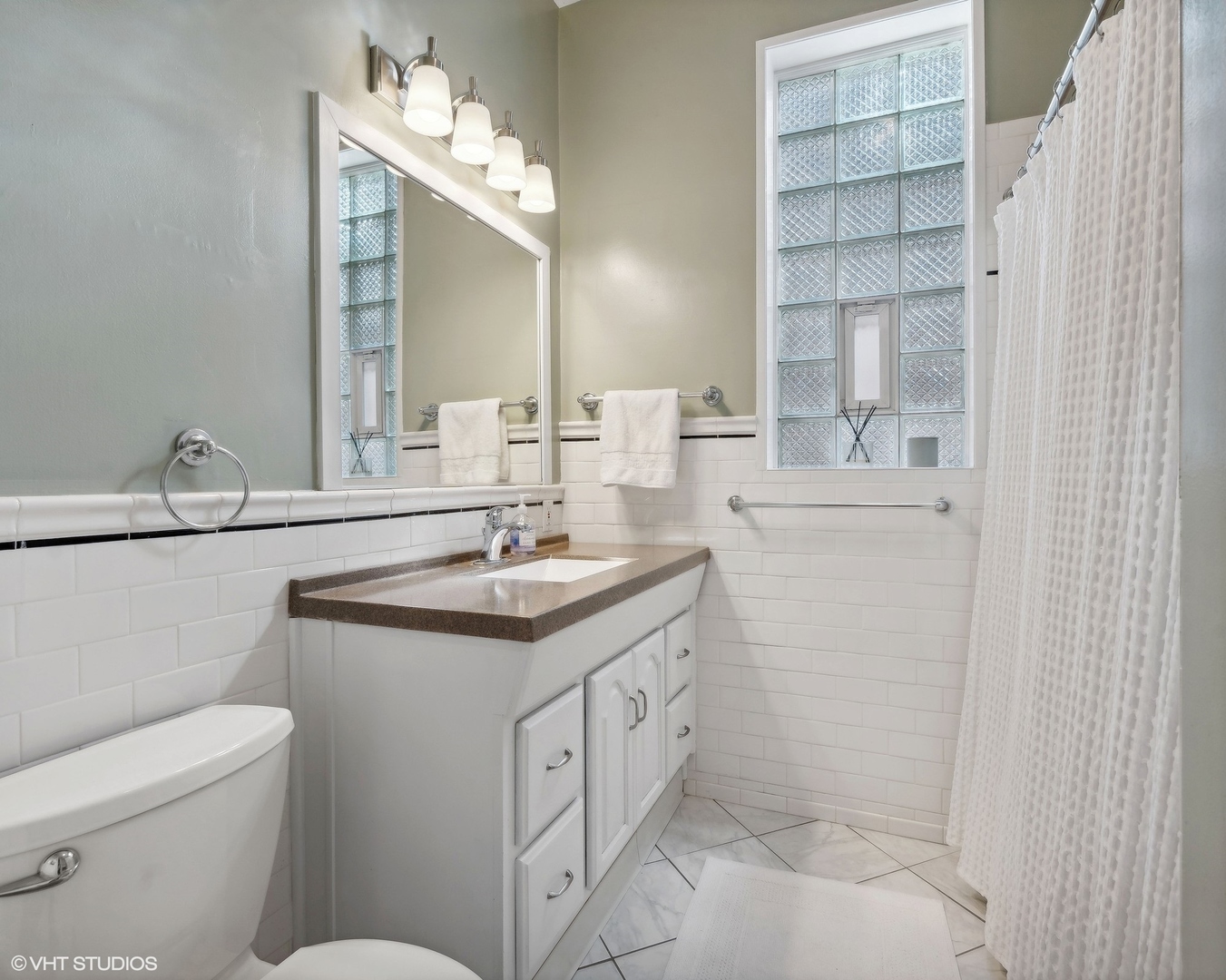 1920 West Addison Street Chicago, IL 60613 - Photo 23 of 34 a bathroom with a sink toilet and shower