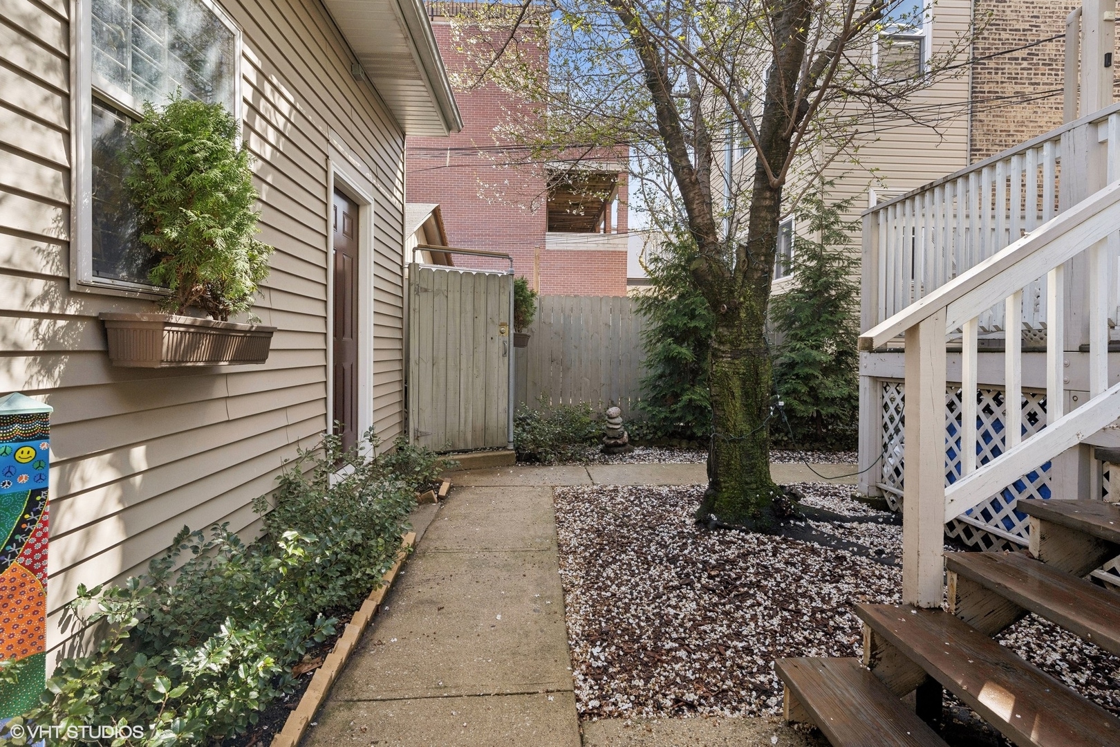 1920 West Addison Street Chicago, IL 60613 - Photo 28 of 34 a pathway of a house with a yard