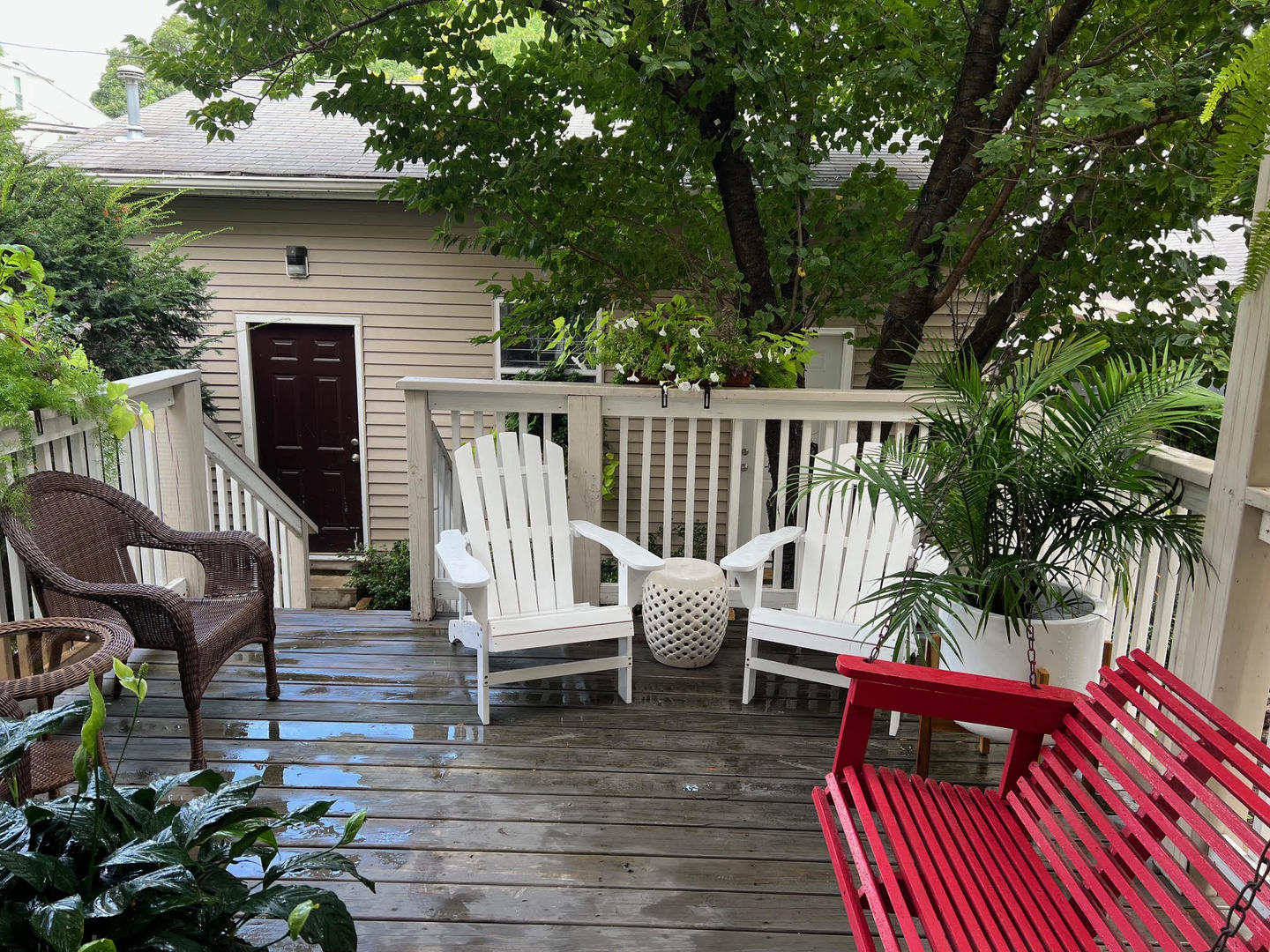 1920 West Addison Street Chicago, IL 60613 - Photo 29 of 34 a view of a patio with couches table and chairs with wooden fence and plants