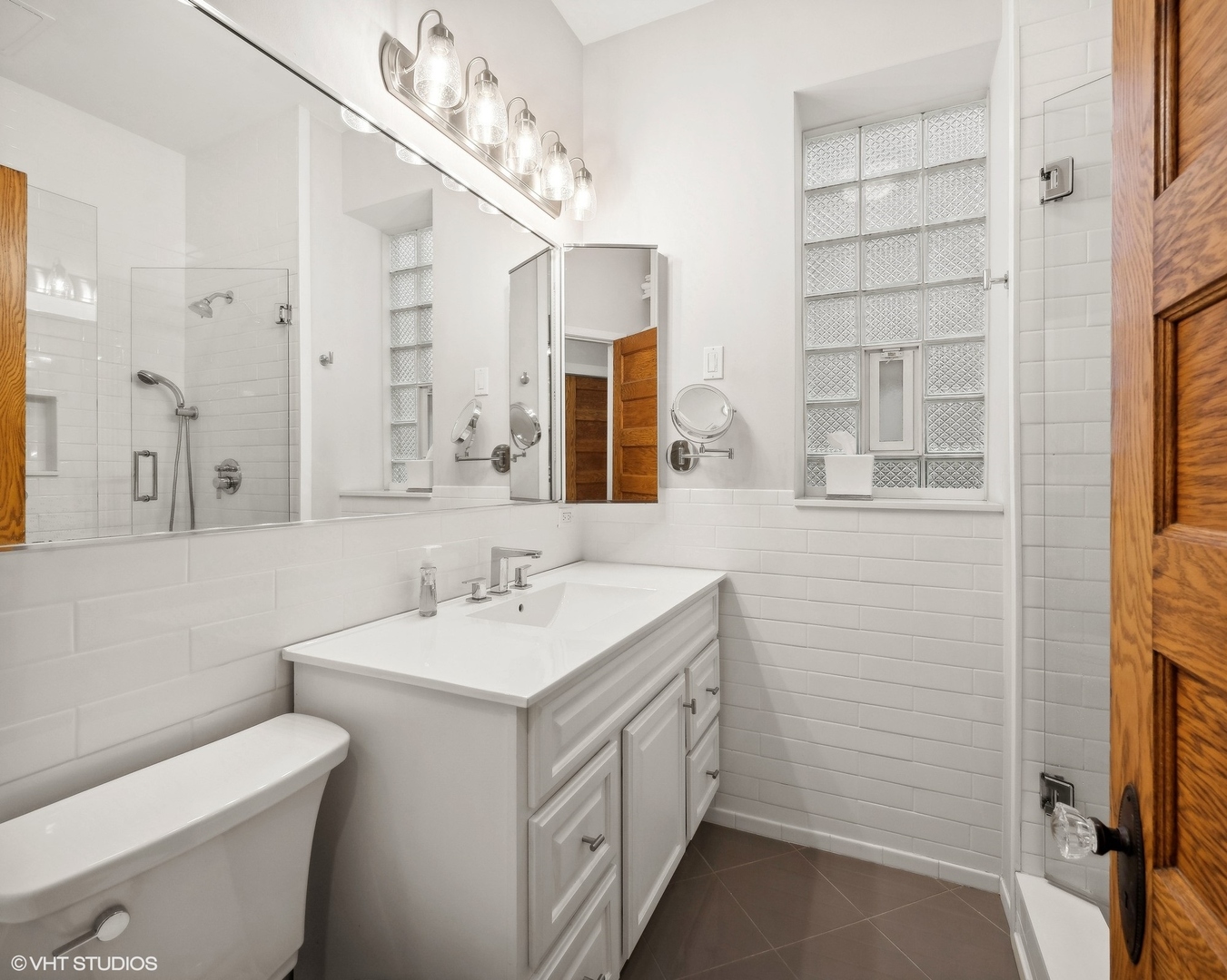 1920 West Addison Street Chicago, IL 60613 - Photo 8 of 34 a bathroom with a double vanity sink mirror and toilet