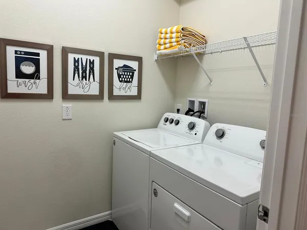 a utility room with dryer and washer