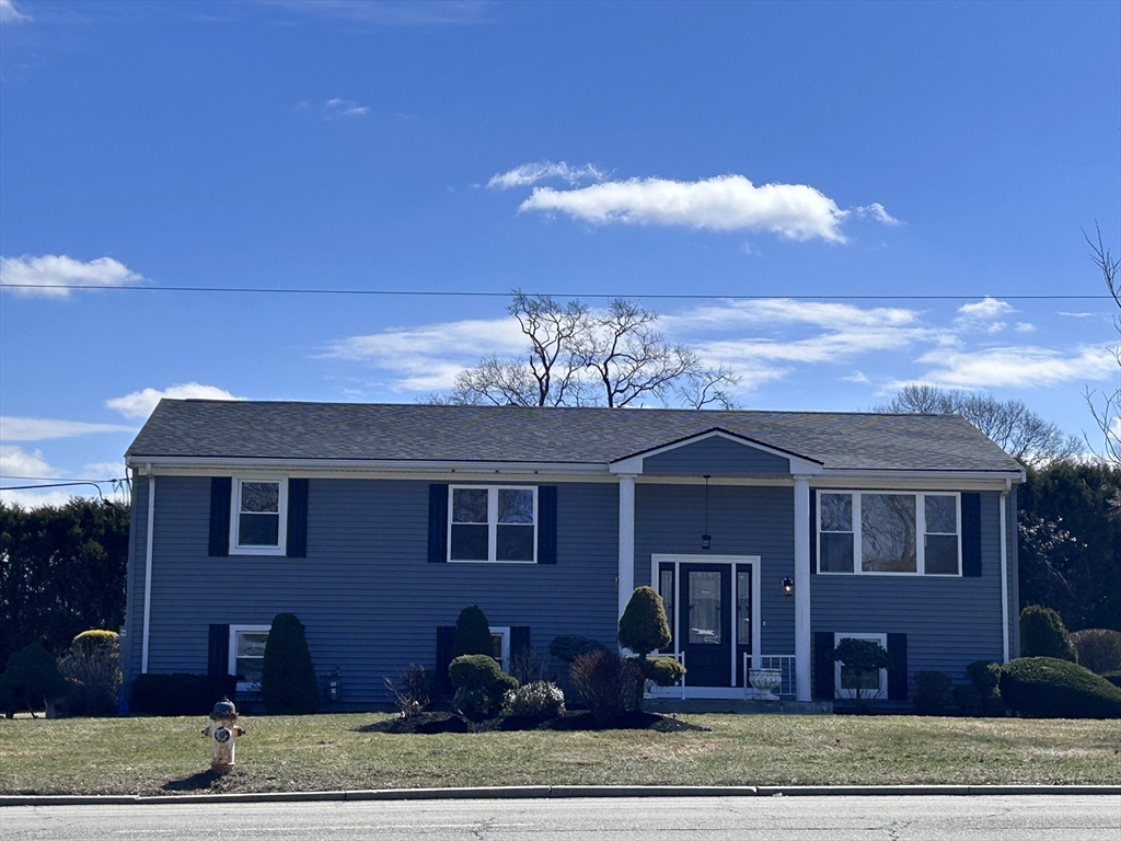 585 North Eastern Avenue Fall River, MA 02720 - Photo 1 of 26 a front view of a house with a yard