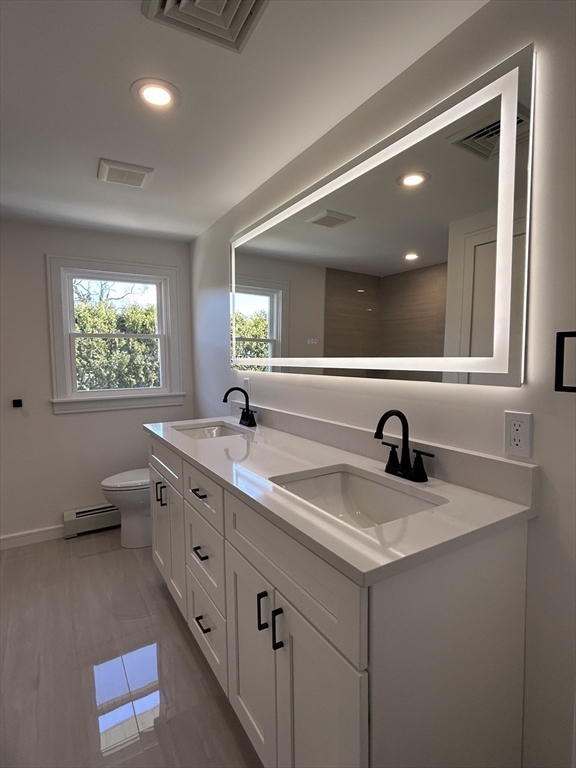 585 North Eastern Avenue Fall River, MA 02720 - Photo 14 of 26 a bathroom with a granite countertop sink mirror and window