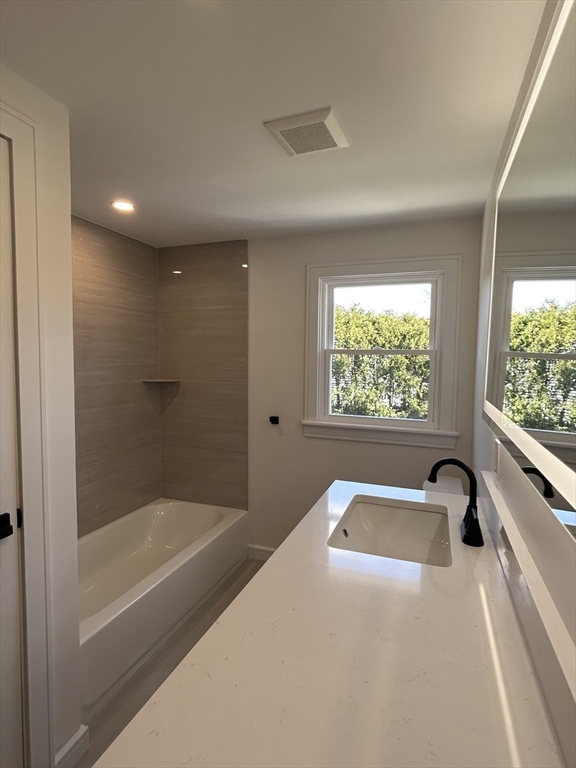 585 North Eastern Avenue Fall River, MA 02720 - Photo 16 of 26 a bathroom with a bathtub and a shower