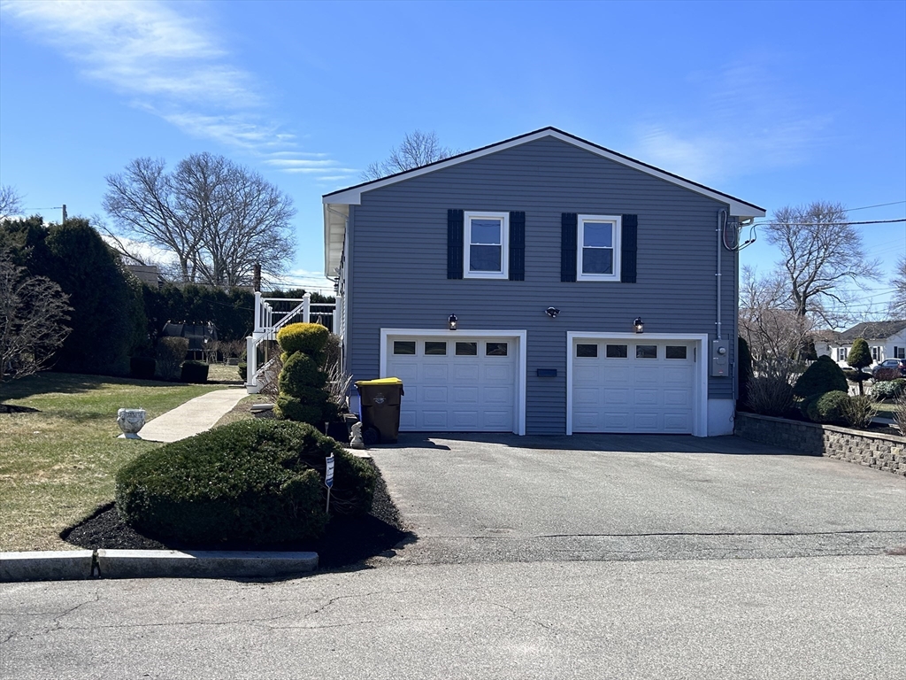 585 North Eastern Avenue Fall River, MA 02720 - Photo 2 of 26 a front view of a house with a yard