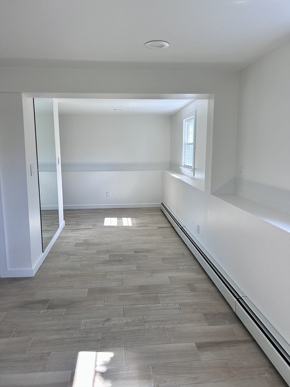 585 North Eastern Avenue Fall River, MA 02720 - Photo 24 of 26 a view of empty room with wooden floor and fan