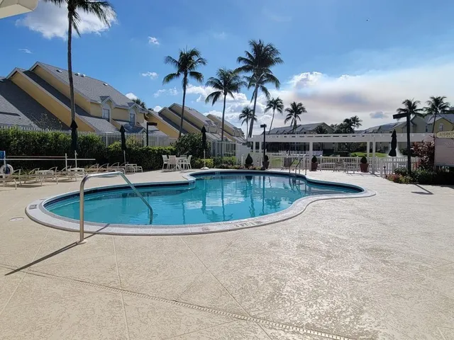 a view of a swimming pool with a patio
