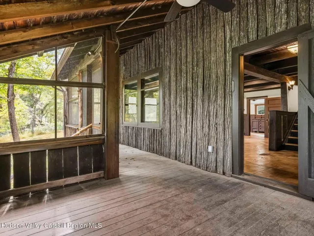 a view of porch with wooden floor