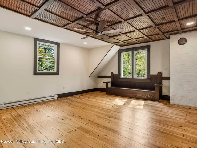 a view of a hallway with a wooden floor
