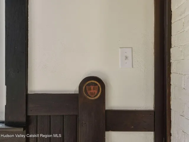 a view of a house with pool and sitting area