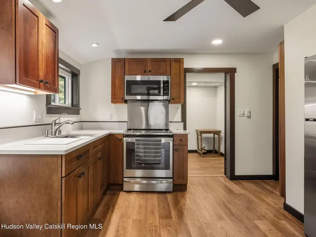 a bathroom with a sink and a large mirror