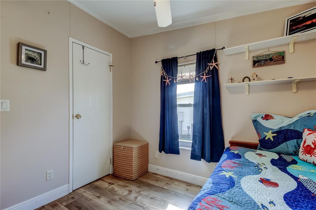 7 Frangipani Circle, Unit 7 Largo, FL 33770 - Photo 36 of 45 a bedroom with a bed and a window