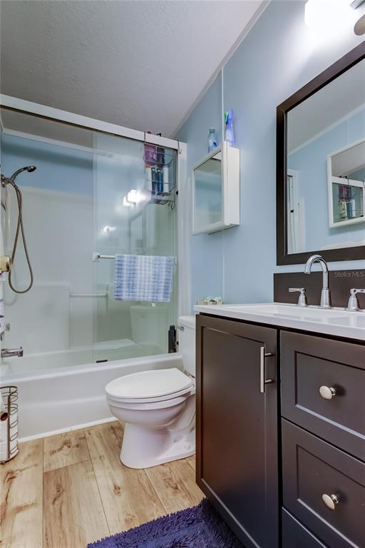 7 Frangipani Circle, Unit 7 Largo, FL 33770 - Photo 38 of 45 a bathroom with a sink toilet and shower