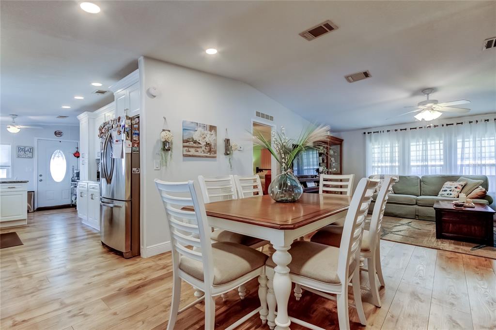 7 Frangipani Circle, Unit 7 Largo, FL 33770 - Photo 9 of 45 a view of a dining room with furniture and wooden floor