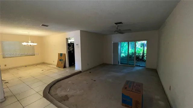 a view of a hallway with a chandelier