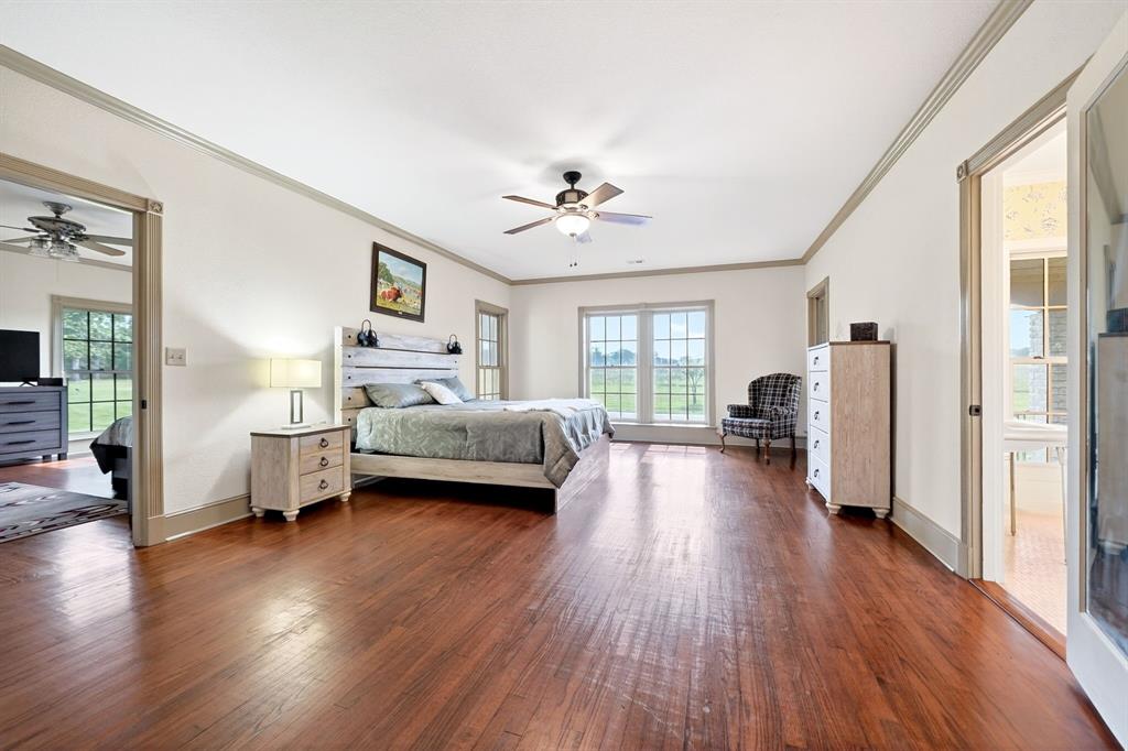 1901 Rose Pointe Athens, TX 75752 - Photo 20 of 37 Spacious room featuring rich wood-finish flooring, a ceiling fan, and white walls with gray trim