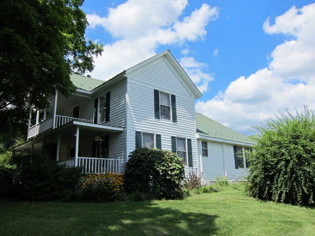 2025 Pete Lynch Road Secondcreek, WV 24974 - Photo 10 of 94 Side View of home, with plenty of flowers and shrubs.