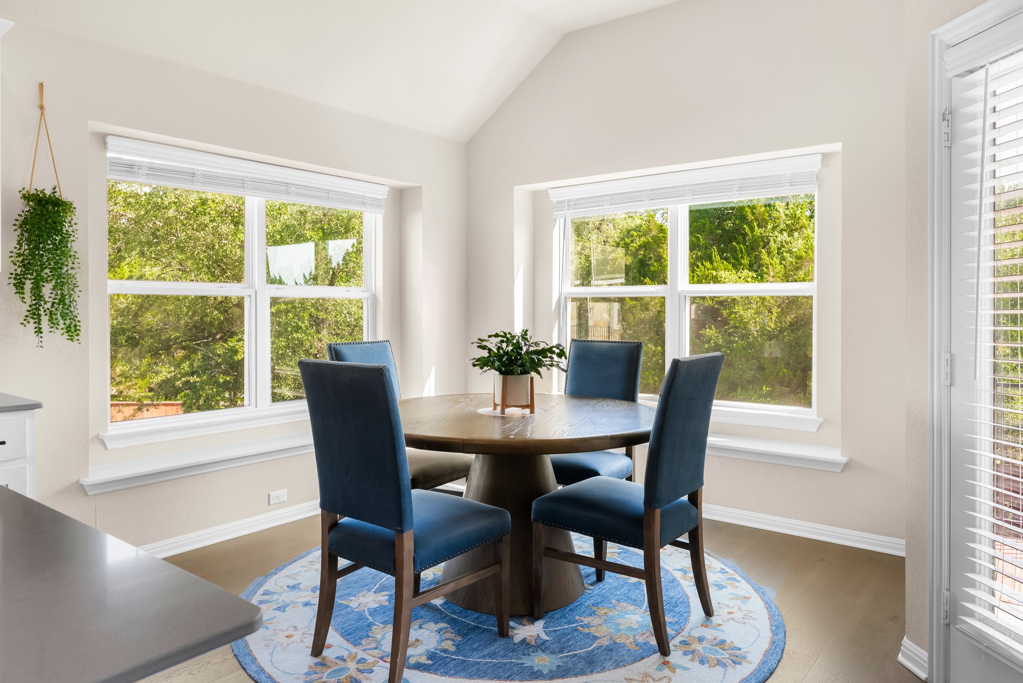 300 Prato Place Georgetown, TX 78628 - Photo 10 of 40 A charming dining area features a vaulted ceiling, wood flooring, and generous natural illumination.