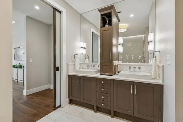 a bathroom with a sink and a mirror