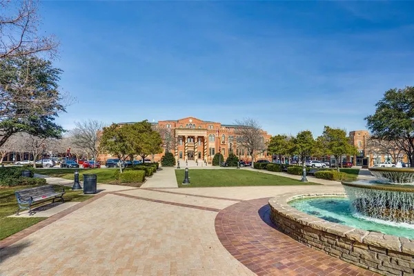 a view of a park with large trees