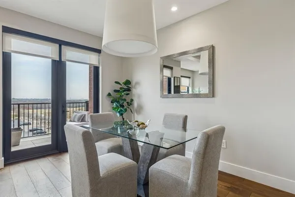 a dining room with furniture and window