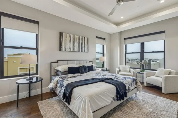 a bedroom with a bed and a couch