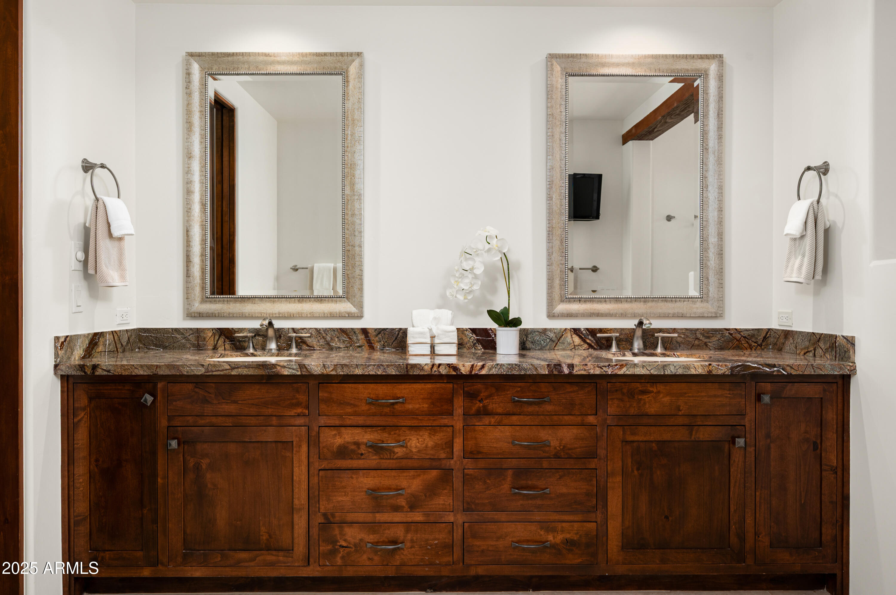 10597 East Rising Sun Drive Scottsdale, AZ 85262 - Photo 23 of 53 a bathroom with a double vanity sink and mirror