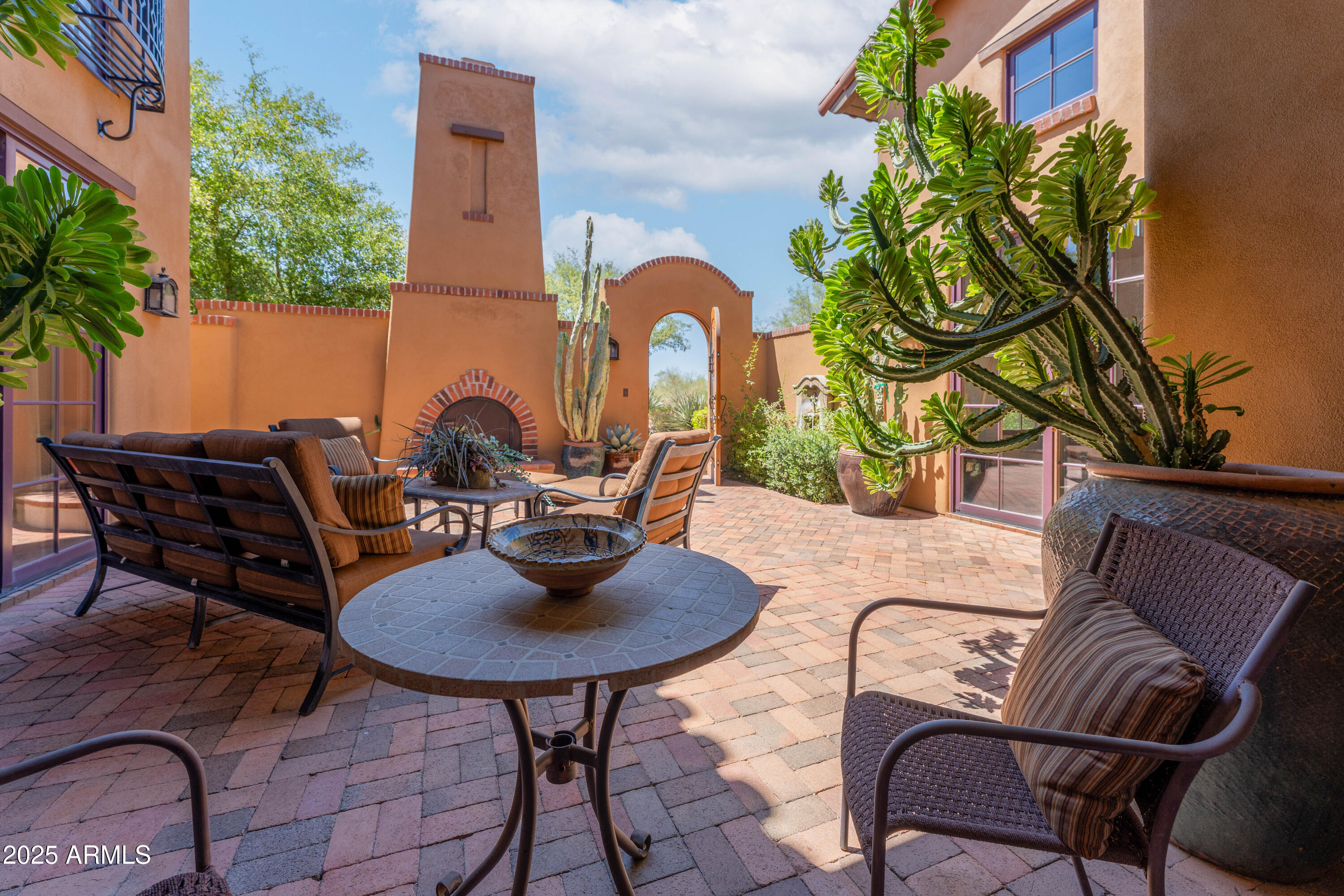 10597 East Rising Sun Drive Scottsdale, AZ 85262 - Photo 41 of 53 a backyard of a house with outdoor seating