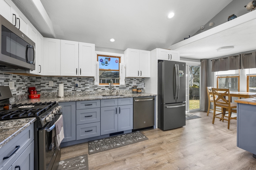 16 Hazelwood Road Dennis, MA 02660 - Photo 12 of 40 a kitchen with stainless steel appliances granite countertop a refrigerator stove microwave and sink