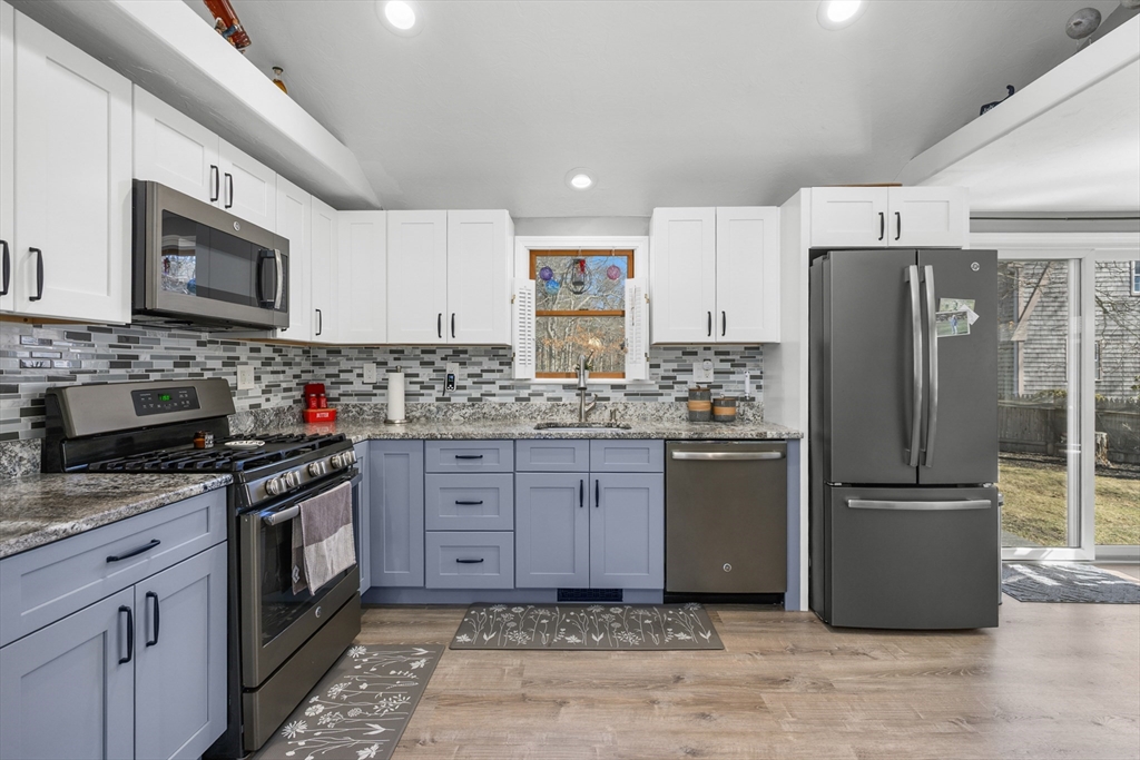 16 Hazelwood Road Dennis, MA 02660 - Photo 13 of 40 a kitchen with stainless steel appliances granite countertop a refrigerator stove and sink