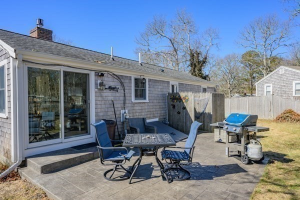 16 Hazelwood Road Dennis, MA 02660 - Photo 27 of 40 a patio with table and chairs