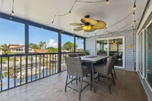 a living room with furniture a fireplace and a floor to ceiling window