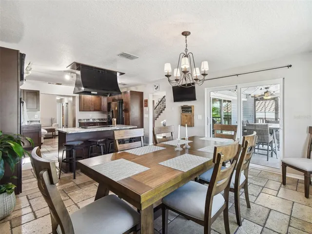 a bedroom with a balcony a bed and a wooden floor
