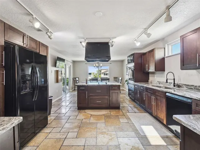 a view of a workspace with furniture and wooden floor