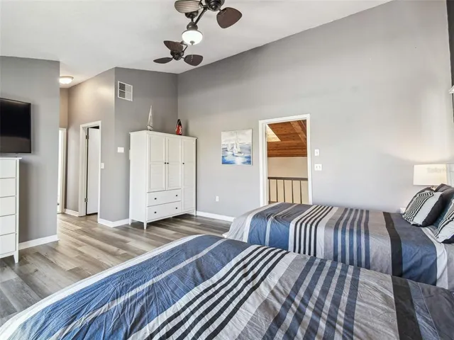 an aerial view of a house with a garden and swimming pool
