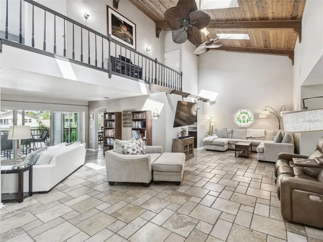 a large kitchen with stainless steel appliances kitchen island granite countertop a sink and cabinets